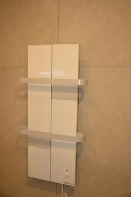 two white shelves on a wall with a box at Milmari L4 in Kopaonik