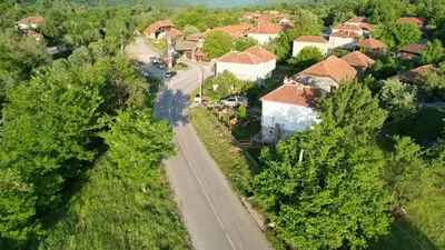an aerial view of a village with a road and houses at VILA BOJANA in Inovo