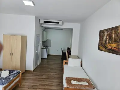a small room with a bed and a couch at Apartments Kuca Aleksic in Niš