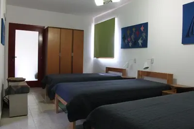 a room with three beds in a room at Boulevard Garden House - Free and save parking in the locked yard in Ćuprija