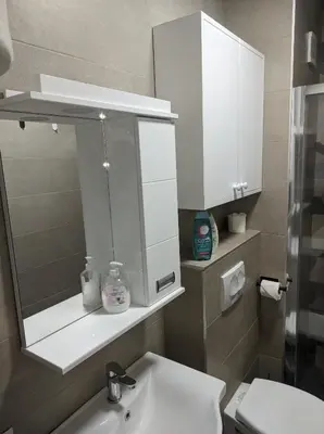 a bathroom with a sink and a mirror at Sokobanja Apartmani in Soko Banja
