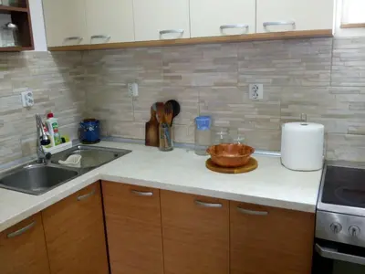 a kitchen with a sink and a counter top at Sokobanja Apartmani in Soko Banja