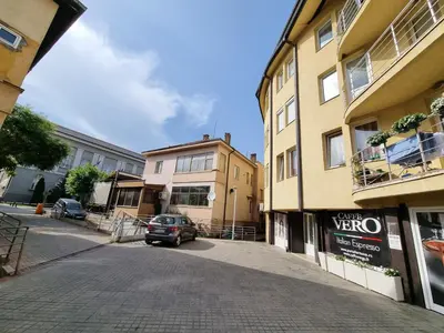 a street with a car parked next to a building at Apartman Veselinovic Free PARKING in Vranje