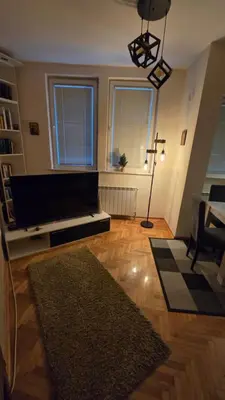 a living room with a couch and a table at Apartman Veselinovic Free PARKING in Vranje