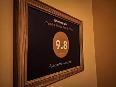 a picture of a clock in a frame on a wall at Apartment Matovic in Vrnjačka Banja