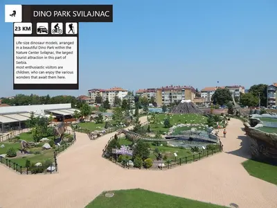a rendering of a park with buildings in the background at Resavsko Etno Selo in Despotovac