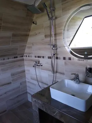 a bathroom with a sink and a mirror at Resavsko Etno Selo in Despotovac