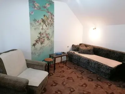 a living room with a couch and two chairs at Apartman Kaća in Vrnjačka Banja