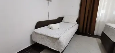 a couch with a pillow on it in a room at Apartments Banjica in Soko Banja