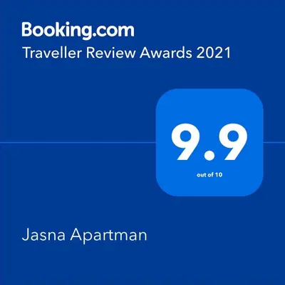 a screenshot of a cell phone with the text travelling review awards at Jasna Apartman in Vrnjačka Banja