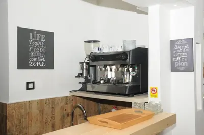 a kitchen with a coffee machine on a counter at AS Apartments in Kopaonik