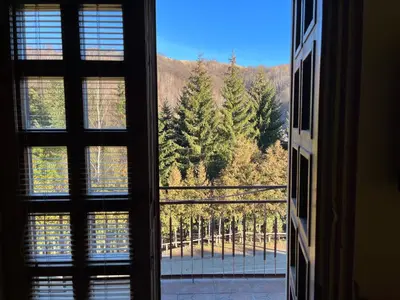 a window with a view of a mountain view at Apartments and Rooms Vicko in Brzeće