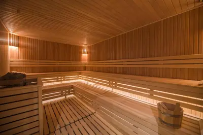 an empty sauna with a bench in the middle at Hotel Tonanti in Vrnjačka Banja