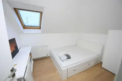 a room with a white couch and a window at Cozy and Lovely Appartment in Jagodina