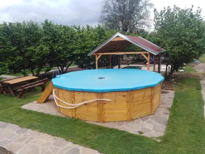 a hot tub with a gazebo in a park at Vila Viktori in Pirot