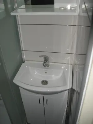 a white sink in a small bathroom at 6 topola in Despotovac