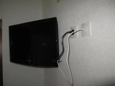 a flat screen tv hanging on a wall at 6 topola in Despotovac