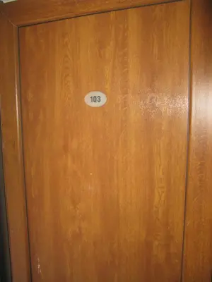 a wooden door with the number on it at 6 topola in Despotovac