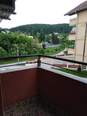a balcony of a building with a view of a street at Apartman Kaja in Vrnjačka Banja