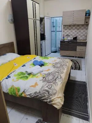 a bedroom with a large bed in a kitchen at TREF 1 in Soko Banja