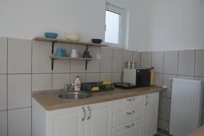 a kitchen with a sink and a microwave at Apartment Mihajlovic in Vranje
