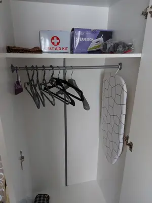 a shelf in a bathroom with some shoes on it at Apartman Kućica za odmor , Drašković in Vrnjačka Banja