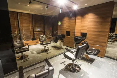 a salon with a bunch of chairs in a room at Ambasador Hotel in Niš