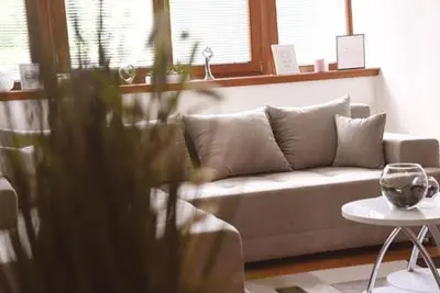 a living room with a couch and a table at Apartman LM in Vrnjačka Banja