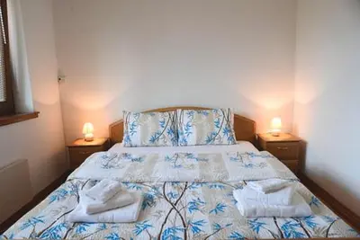 a bedroom with a bed with two towels on it at Apartman LM in Vrnjačka Banja