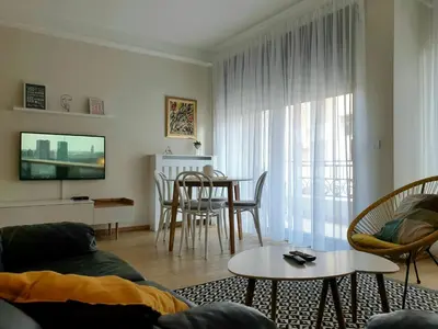 a living room with a couch and a table at PRONTO apartman & PRONTO studios in Kruševac