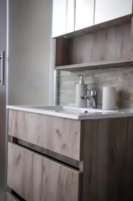 a bathroom with a sink and a counter top at Venus in Niš