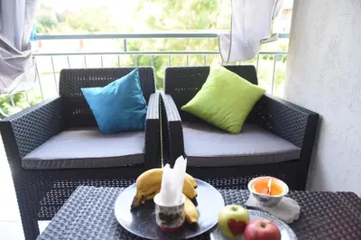 a table with a plate of fruit on a patio at Paradise in Vrnjačka Banja