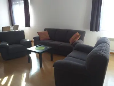 a living room with a couch and two chairs and a table at Sanjar in Vrnjačka Banja
