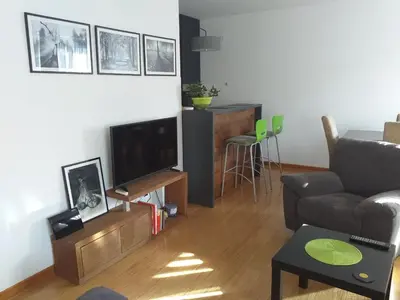 a living room with a couch and a television at Sanjar in Vrnjačka Banja