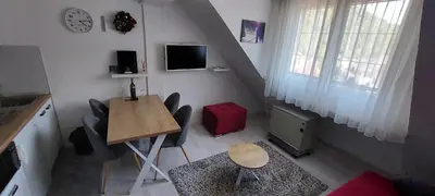 a small room with a table and chairs and a table and a table at Uni Kop in Brzeće