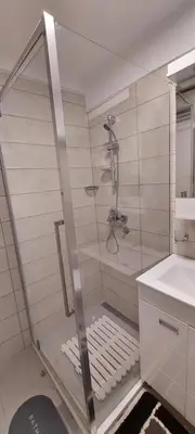 a shower with a glass door in a bathroom at Uni Kop in Brzeće