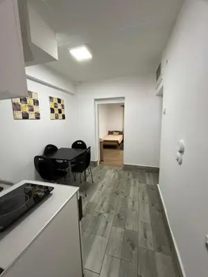a kitchen and dining room with a table and chairs at Vojin i Lena in Soko Banja