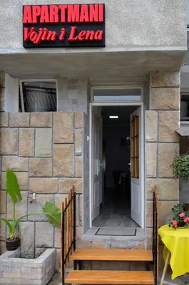 a entrance to a restaurant with a sign on a building at Vojin i Lena in Soko Banja
