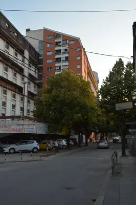 a group of people walking down a city street at VIV apartment 1 in Niš