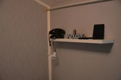 a door with a shelf on the wall at VIV apartment 2 in Niš