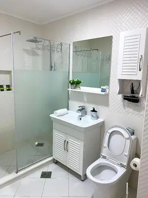 a bathroom with a toilet and a sink and a shower at Lux Apartman 'Opereta' A-19 in Vrnjačka Banja