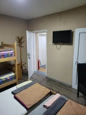 a living room with a tv on the wall at Apartments Day Off in Aleksinac