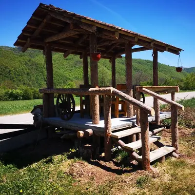 a small wooden structure with a woodenoked at Etno Konak Angela in Kalna