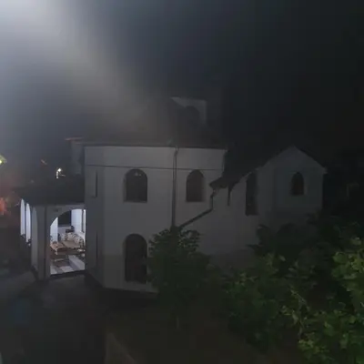 a white house at night with a fog at Knez Apartmani in Senje