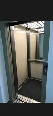 a mirror in a bathroom with a walk in shower at La Apartamento in Jagodina