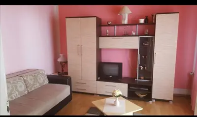 a living room with a couch and a tv at Apartman Luka in Soko Banja