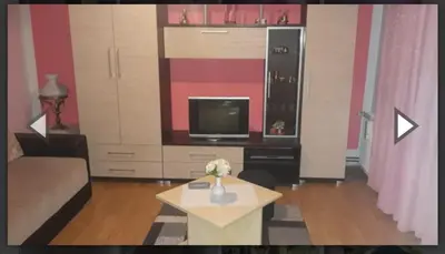 a living room with a couch and a tv at Apartman Luka in Soko Banja