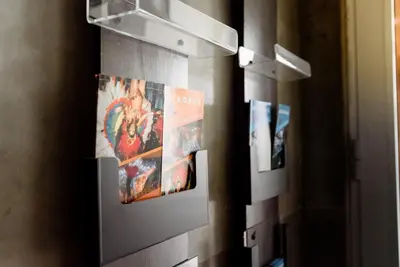 a wall with pictures on it in a room at Sajam B&B in Leskovac