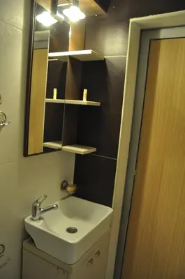 a bathroom with a sink and a mirror at Eco Kop in Kopaonik