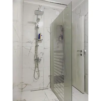 a shower with a glass door in a bathroom at Vladana DELUXE App 2 in Kruševac